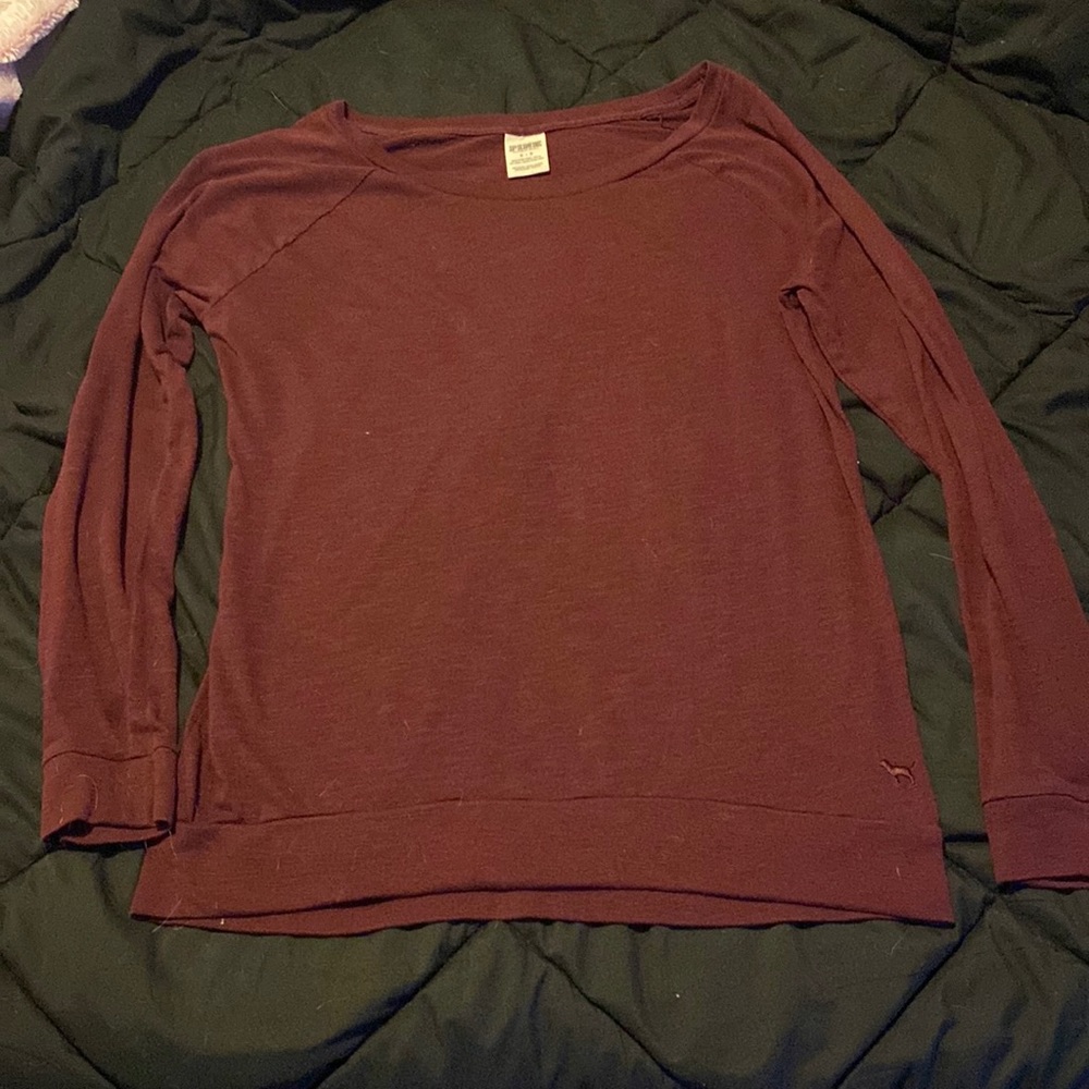 The is a “Pink” long sleeve. Purple-ish color.